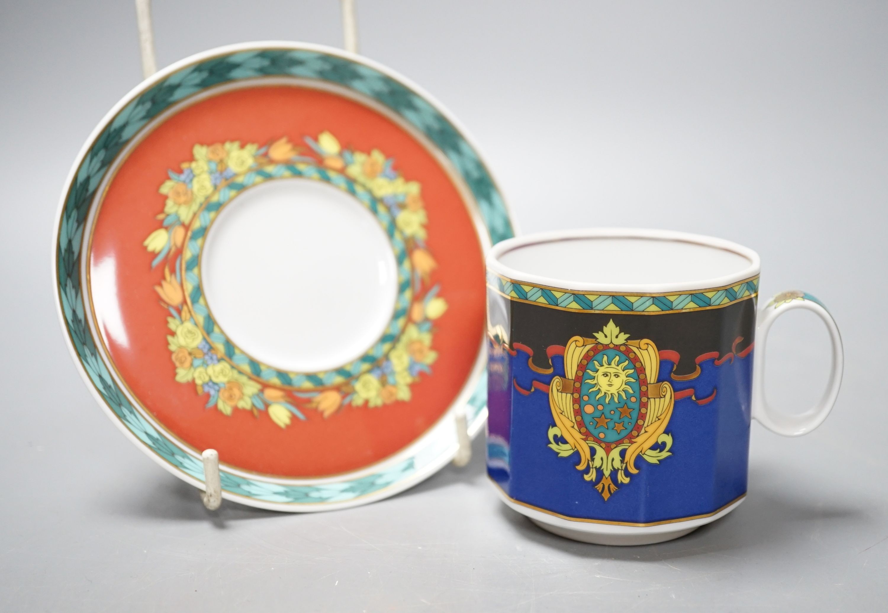 A set of eight Versace 'Le Roi Soleil' pattern cups and saucers